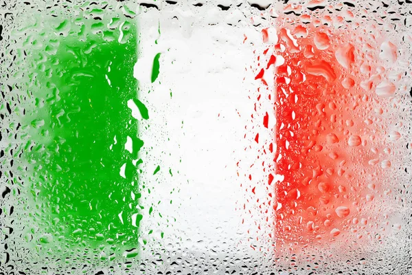 Flag of Italy. Italy flag on the background of water drops. Flag with raindrops. Splashes on glass. Abstract background