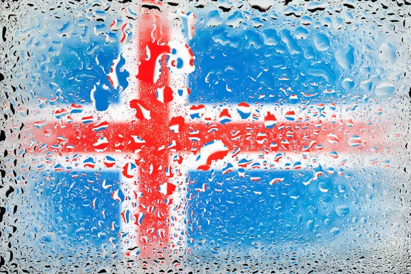 Flag of Iceland. Iceland flag on the background of water drops. Flag with raindrops. Splashes on glass. Abstract background