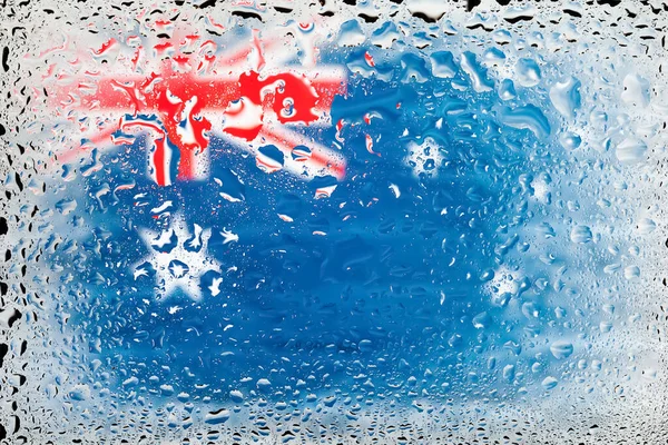 Flag of Australia. Australia flag on the background of water drops. Flag with raindrops. Splashes on glass. Abstract backgroundAustralia