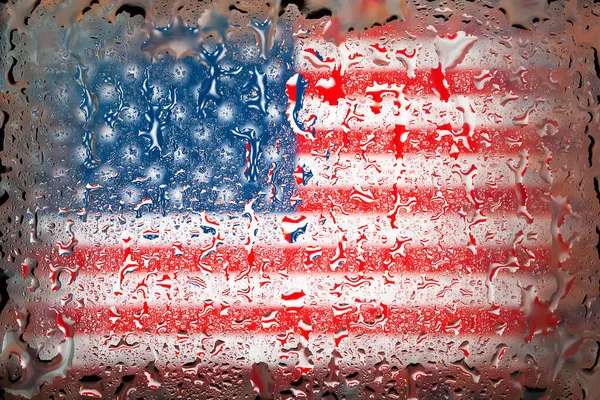 American flag. USA flag on the background of water drops. Flag with raindrops. Splashes on glass. Abstract background