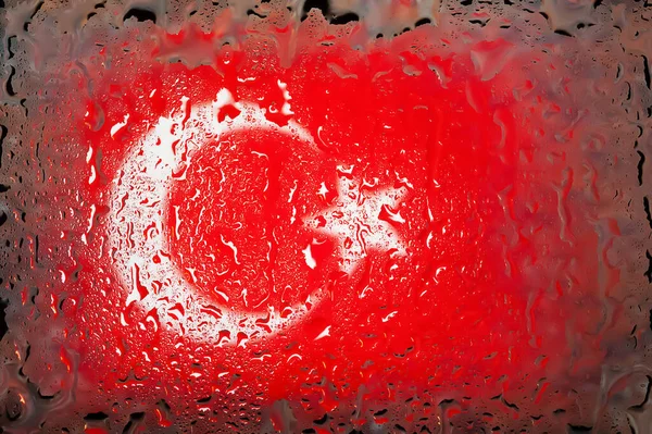 Turkey flag. Turkey flag on the background of water drops. Flag with raindrops. Splashes on glass. Abstract background