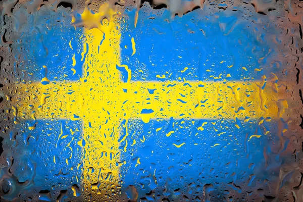 Sweden flag. Sweden flag on the background of water drops. Flag with raindrops. Splashes on glass. Abstract background