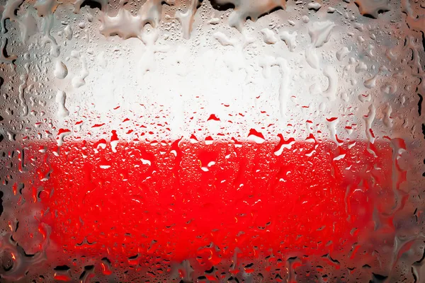 Poland flag. Poland flag on the background of water drops. Flag with raindrops. Splashes on glass. Abstract background