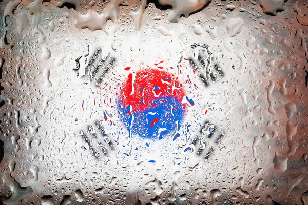 South Korea flag. South Korea flag on the background of water drops. Flag with raindrops. Splashes on glass. Abstract background