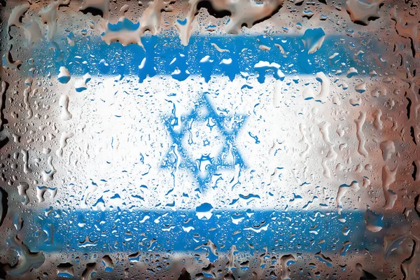 Israel flag. Israel flag on the background of water drops. Flag with raindrops. Splashes on glass. Abstract background