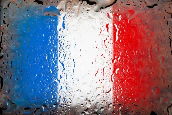 France flag. France flag on the background of water drops. Flag with raindrops. Splashes on glass. Abstract background