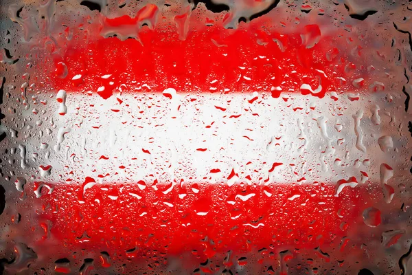 Austria flag. Austria flag on the background of water drops. Flag with raindrops. Splashes on glass. Abstract background