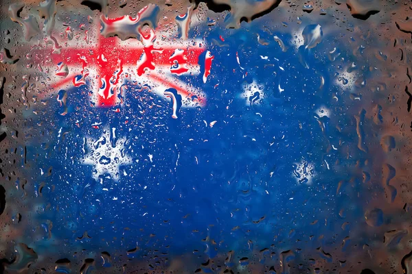 Australia flag. Australia flag on the background of water drops. Flag with raindrops. Splashes on glass. Abstract background