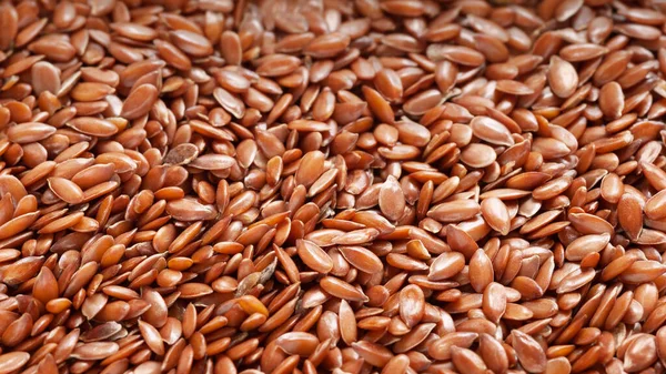 Flax seeds. Flax seeds close up. Seed texture. Omega 3. Healthy food. Selective soft focus