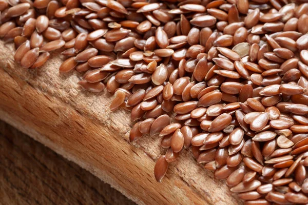 Flax seeds. Flax seeds on a wooden board close-up. Omega 3. Healthy nutrition. Top view