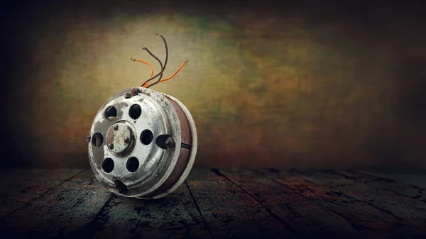 Electrical engine. Old electric motor on abstract grunge background. Old electrical equipment. Hardware details