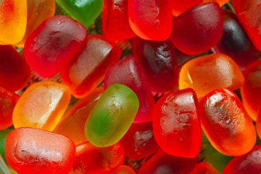 Jöleli şekerler. Çok renkli jöle tatlısı çeşitleri. Üst Manzara. Şeker arkaplanı