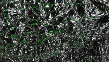 Parlak yüzey. Kırışık folyo. Buruşuk arka plan. Seçici yumuşak odak