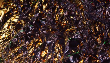 Parlak yüzey. Buruşmuş altın folyo. Buruşuk arka plan. Yumuşak odak