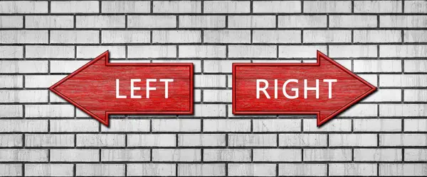 Red wooden arrow signs with the inscription LEFT and RIGHT hang on a white brick wall. Right and left arrow pointers. Set direction signs