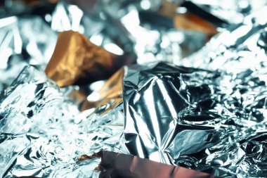 Folyo dokusu. Renkli soyut. Şeker ambalajlarına yakın çekim. Yumuşak odak