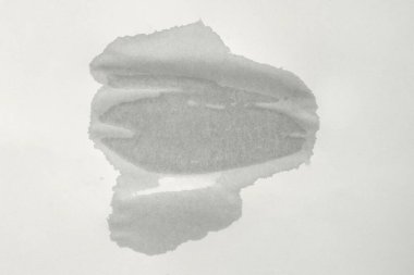 Kağıt üzerinde ıslak bir nokta. Boş eski bir kağıt parçası. Sıçramalardan zarar gören kağıt dokusu