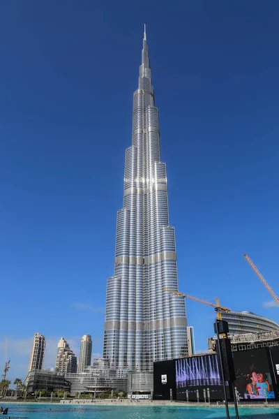 stock image Dubai, UAE - February 14,2022: Burj Khalifa Tower in the heart of Dubai. Burj Dubai, a skyscraper in the United Arab Emirates. Known for being the world tallest building. Blue sky behind the building