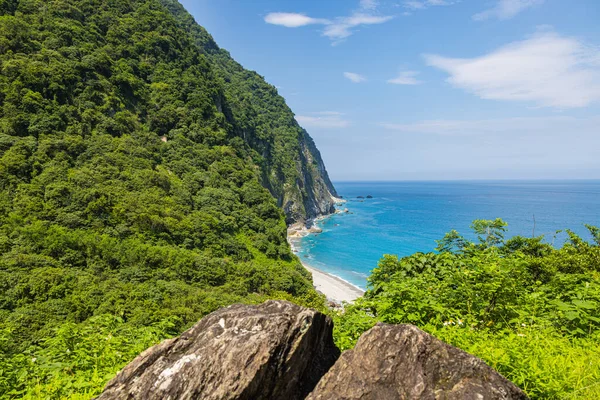 stock image Stunning view reveals the grandeur of the cliffs at Taiwan southeast coast, Qingshui Cliff near Taroko National Park. Towering and lush, they overlook the azure sea, evoking a sense of awe. Landscape