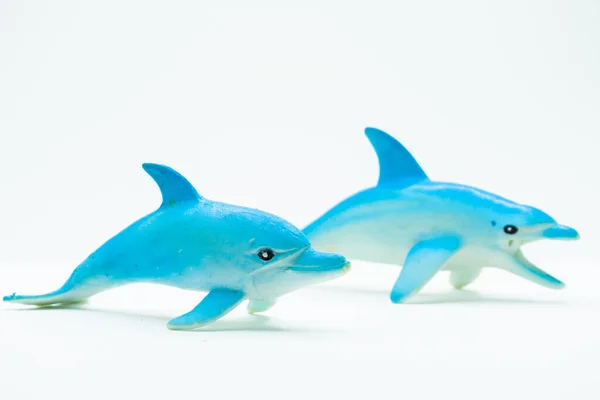 stock image View of Dolphin toy made of rubber. Isolated on white background without shadow. Squeaky rubber dolphin plaything. Childrens small bathub elastic dolphin.