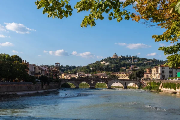 stock image View of Verona historical city centre, Ponte Pietra bridge across Adige river, Verona Cathedral, Duomo di Verona, red tiled roofs, Veneto Region, Italy. Verona cityscape, panoramic view.