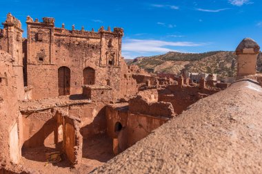 An old kasbah that served as a base for nomadic tribes, with a sense of ruggedness and adventure.