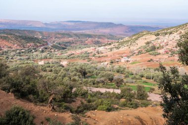Panoramic view of the Atlas Mountains in Morocco and its curved roads to cross them
