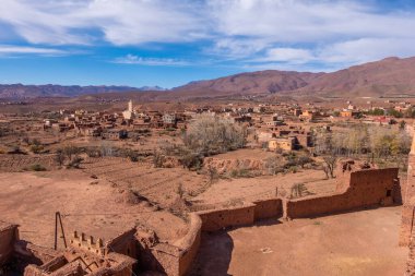 An old kasbah that served as a base for nomadic tribes, with a sense of ruggedness and adventure.
