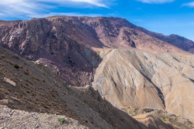 Panoramic view of the Atlas Mountains in Morocco and its curved roads to cross them