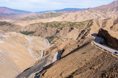 Panoramic view of the Atlas Mountains in Morocco and its curved roads to cross them