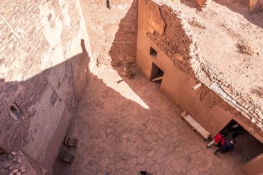 An old kasbah that served as a base for nomadic tribes, with a sense of ruggedness and adventure.