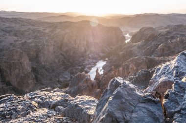 River flow in the black rocky Atlas Mountains in Morocco.