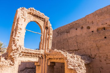 Ruins of an ancient abandoned kasbah along the road through the atlas mountains to arrive in the sahara desert in morocco