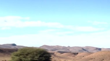 The beauty of Moroccos Atlas Mountains on a road trip filled with scenic vistas and traditional Berber villages.