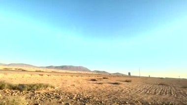 The Atlas Mountains plateau with rocksand constructionsonstructions. High quality 4k footage