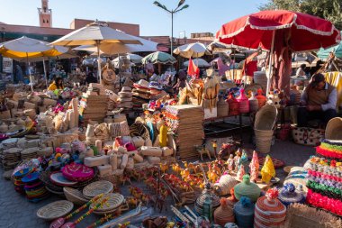 market stalls with typical straw products in the souk of Jemaa el-Fnaa square in Marrakesh in Morocco