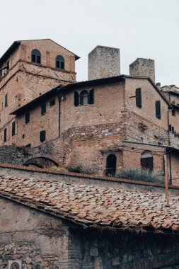 Ancient brick building in a town in the mountains of Tuscany in Italy