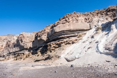 Mountains formed out of sand blown by the wind in Santorini Greece
