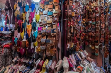 Colorful moroccan leather babouche for sale in a souk in Marrakesh Morocco