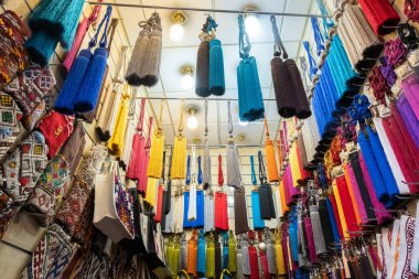 colorful typical curtain tassels hanging in a shop in a souk in marrakech. Morocco