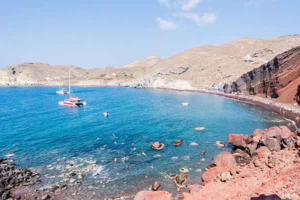The red earth of the rocky coast of the red beach in santorini in greece