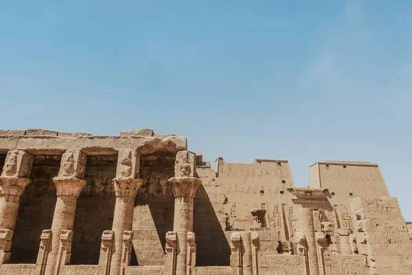 Explore the statues and relics that adorn the grounds of an ancient Egyptian temple. A must-see for archaeology and history enthusiasts. Experience Egypts summer allure through captivating images of