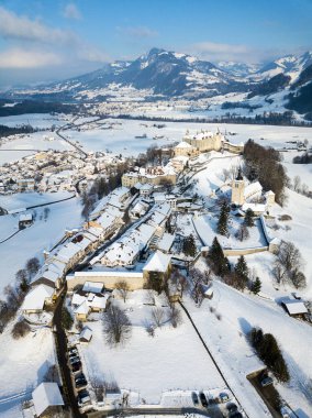 Aerial image of the medieval town Gruyeres with Castle on the hill top of Alps in winter. It is one of the most popular tourist destionations.