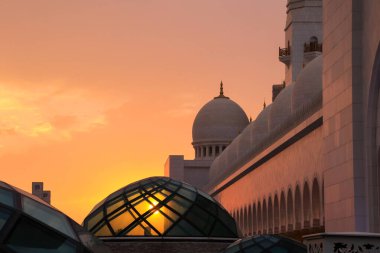 The sunset through the glass dome at the Sheikh Zayad Grand Mosque in Abu Dhabi.