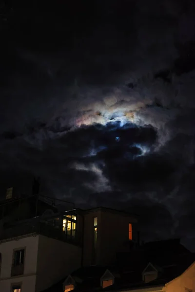 Mysterious clouds shape like a mushroom blocking the moonlight in the early winter evening sky