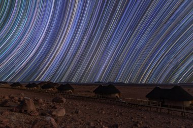 Namibia - July 2024: Star trails over the Soussvlei travellers lodges, Naukluft park, Namibia clipart