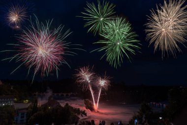 Firework composite over the Rhinefall to  traditionally  celebrate the Swiss National Day on 1. August each year clipart