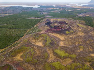 Aerial view of rootless cones or pseudocraters beside the Kerid crater, Iceland clipart