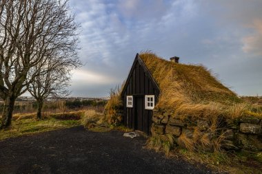 Old traditional Icelandic turf house with grass roof, Iceland clipart