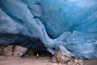 Dangerous ice cave entrance with huge hanging ice block overhead in the Swiss Alps Moteratsch Glacier. (taken in Mar. 2025)